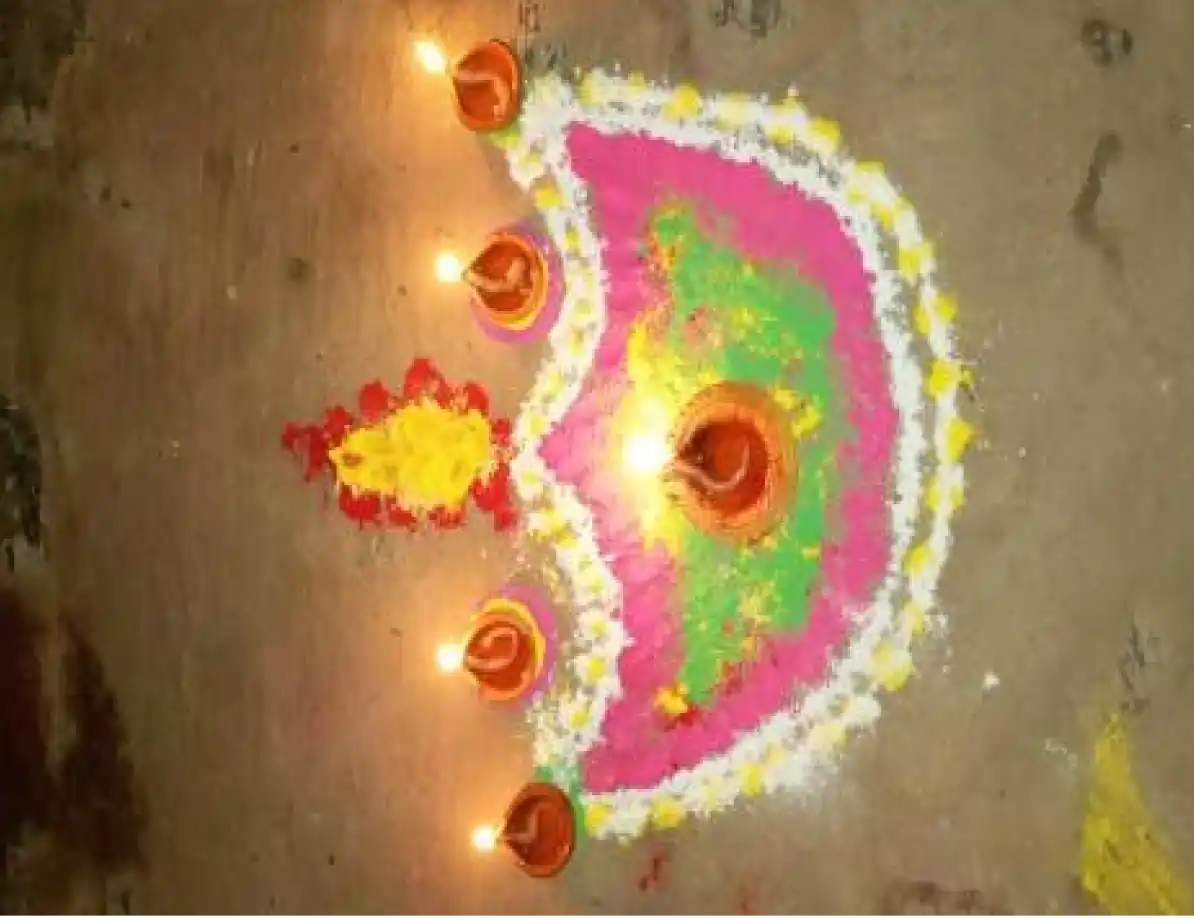 Colourfully Filled Rangoli in Diya Shape